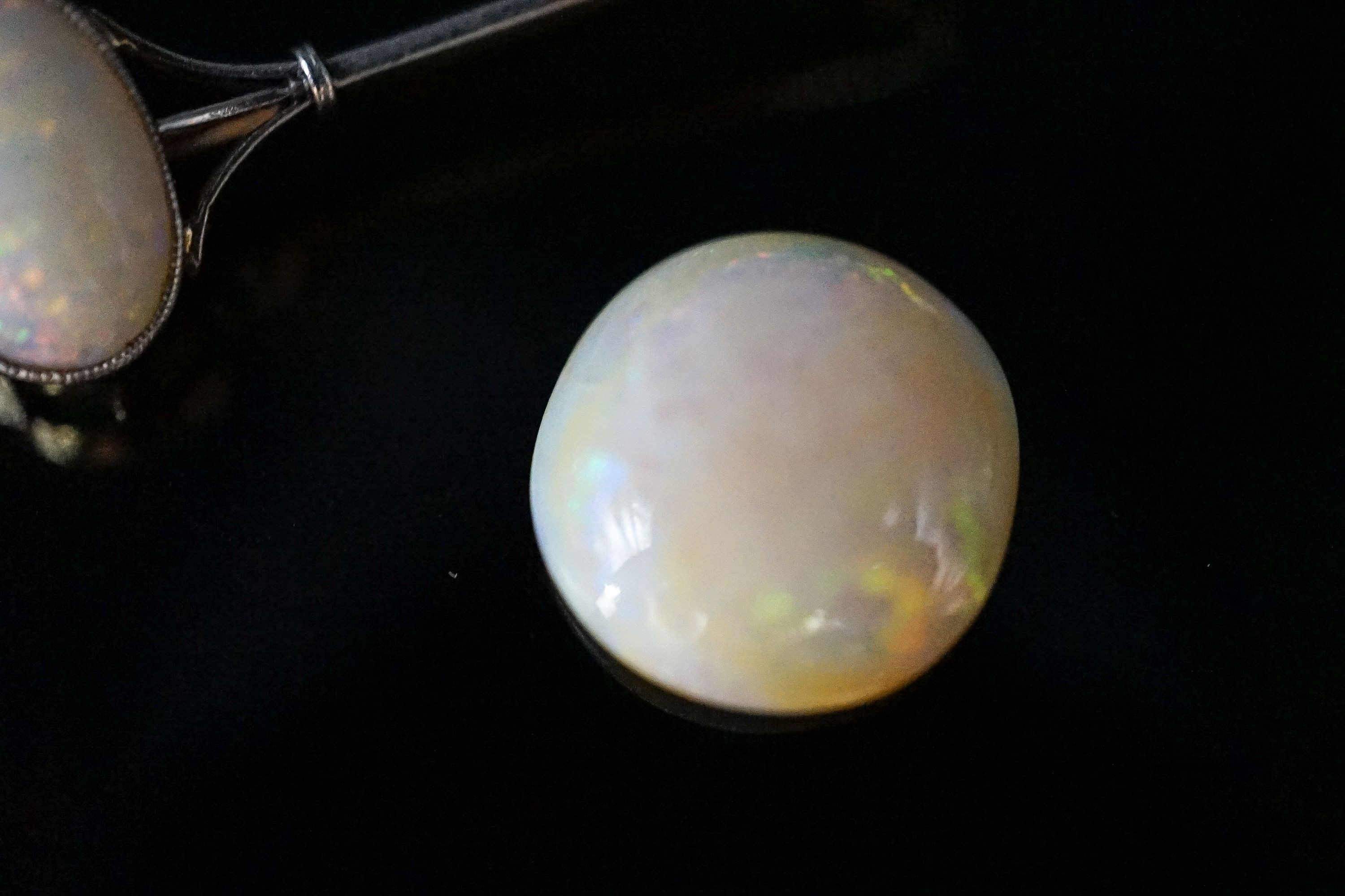 A yellow metal and white opal set bar brooch, 63mm, gross 4.9 grams and a loose white opal.